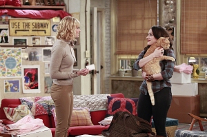 "And The Fat Cat" -- A handsome businessman returns Max and Caroline's missing cat, Nancy, who comes home with a big surprise, on 2 BROKE GIRLS, Monday, March 23 (8:00-8:30 PM, ET/PT) on the CBS Television Network. Caroline Channing (Beth Behrs), left, and Max Black (Kat Dennings), shown. Photo: Sonja Flemming/CBS ÃÂ©2015 CBS Broadcasting, Inc. All Rights Reserved